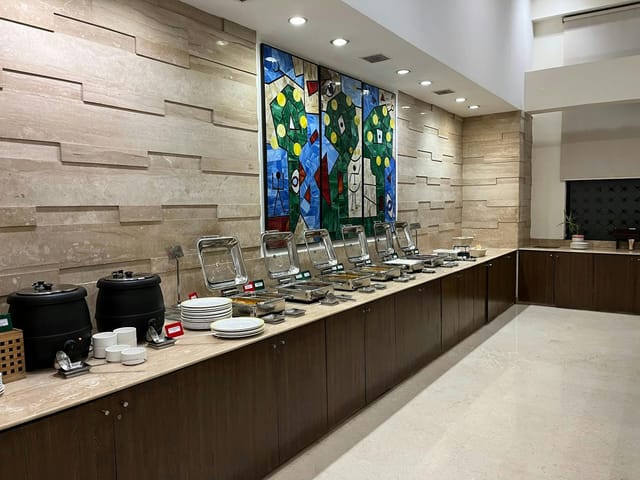 Buffet setup at Tangerine 2, Lemon Tree Premier Gurgaon with elegant decor for events.