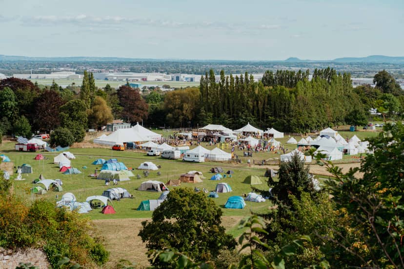 Hawarden Castle Pavilion with tents for a vibrant outdoor festival event.