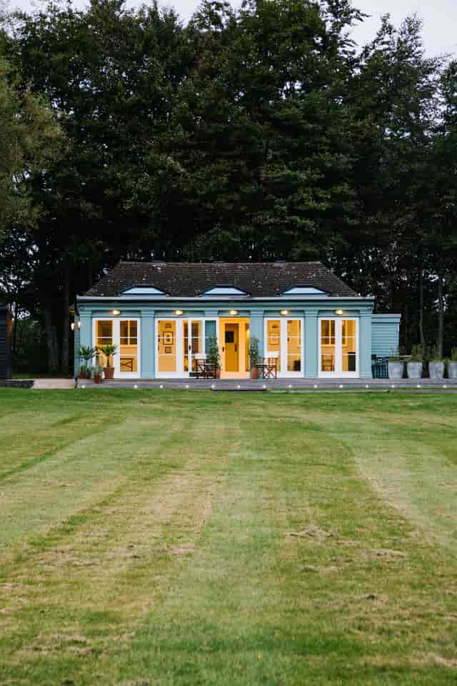 Hawarden Castle Pavilion with blue exterior, ideal for workshops and intimate events.