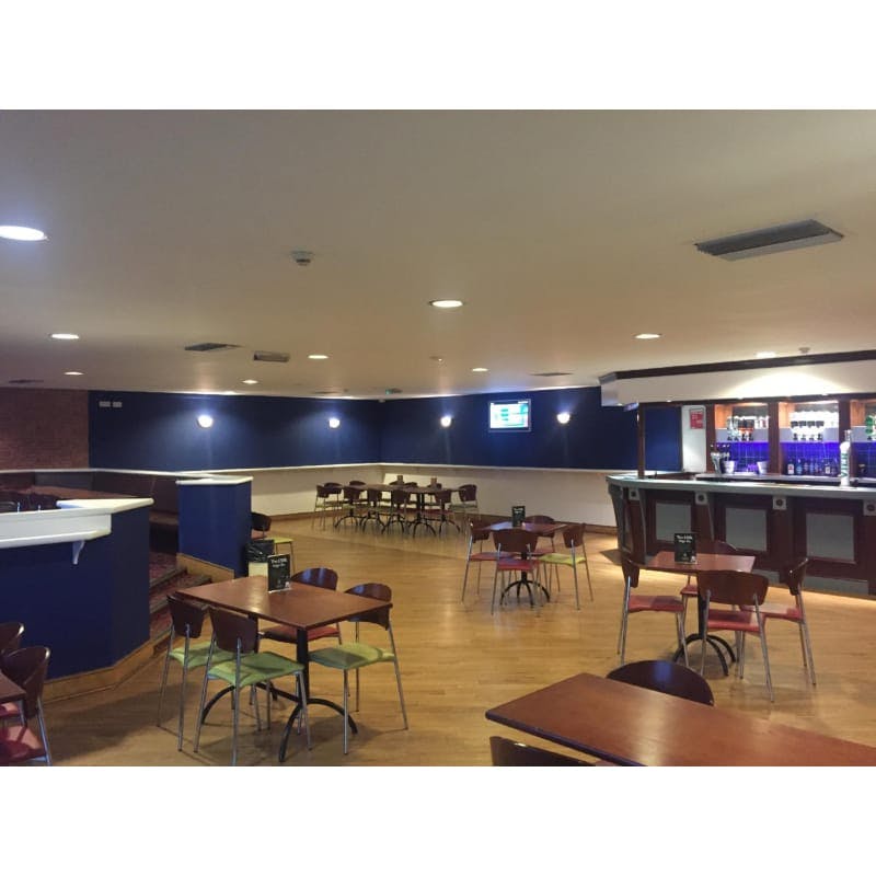 Function room at Powerleague Slough with modern bar, ideal for networking events and conferences.