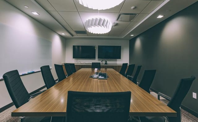 Modern conference room in Cambridge, MA with ergonomic chairs for professional meetings.