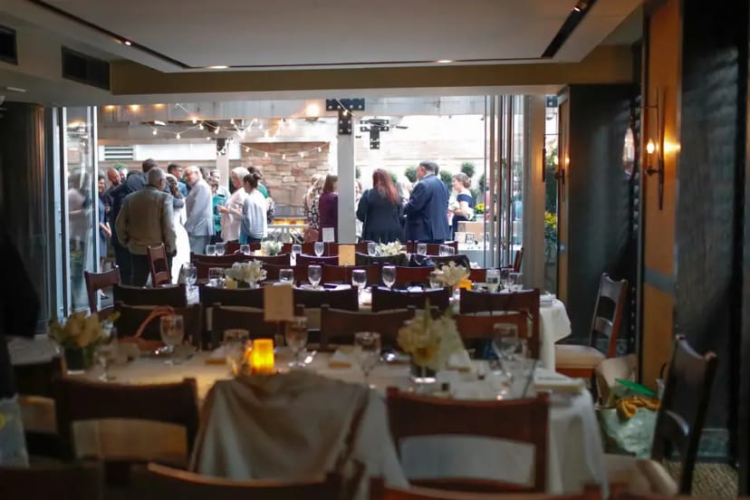 Elegant dining area in Harvest restaurant, perfect for upscale networking events.