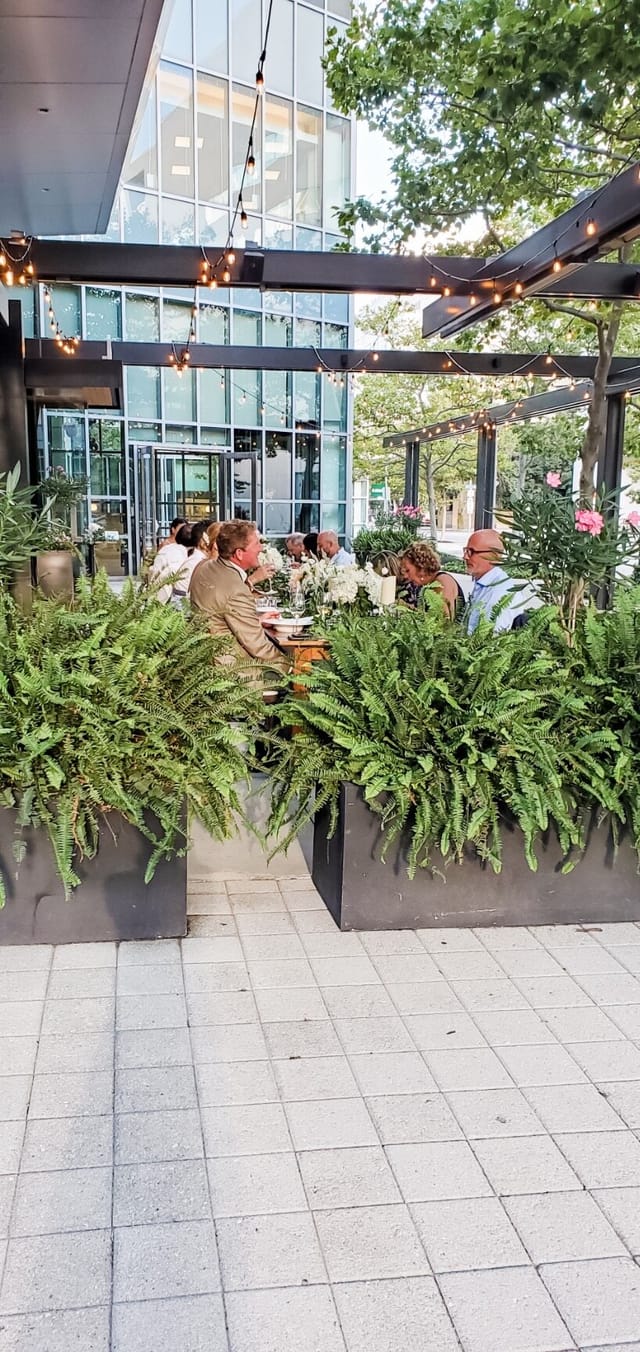 Sophisticated outdoor dining setup at Catalyst Restaurant, ideal for corporate events.
