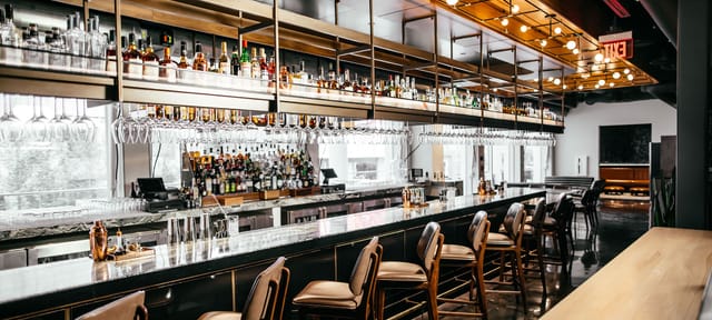 Modern bar setup in The Exchange Food Hall for networking events and cocktail receptions.