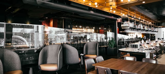 Modern Food Hall with cozy seating, ideal for corporate meetings and social events.
