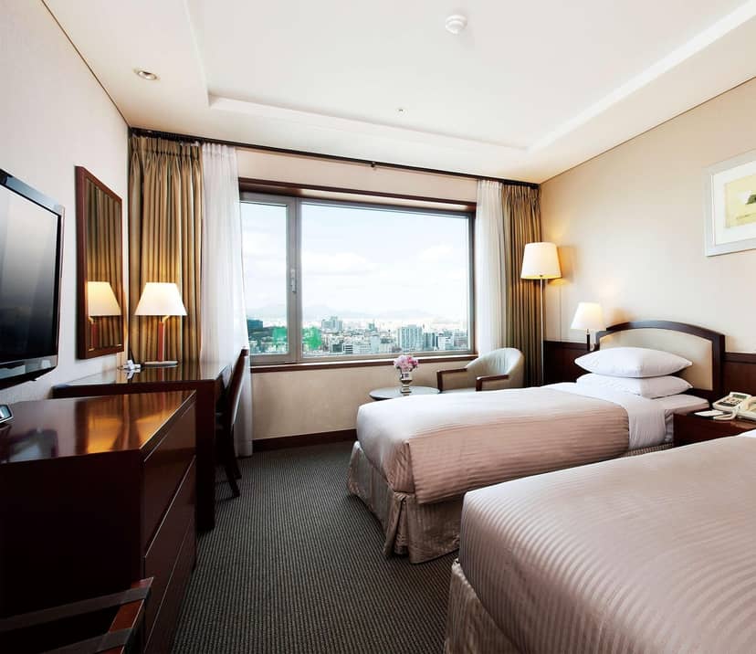 Best Western Premier Gangnam hotel room with twin beds, ideal for business events.