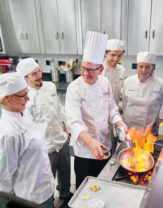 Culinary demonstration at Cambridge School of Culinary Arts, perfect for team-building events.