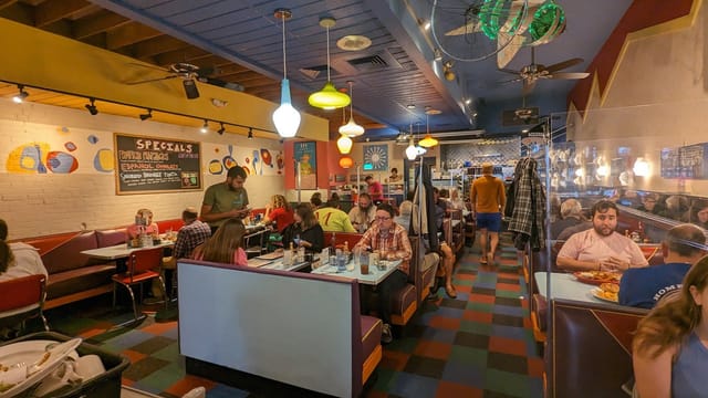 Vibrant diner interior at Johnny's Luncheonette, perfect for casual gatherings and events.