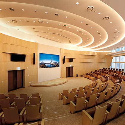 Modern conference room with tiered seating for corporate events at SKY31 Convention.