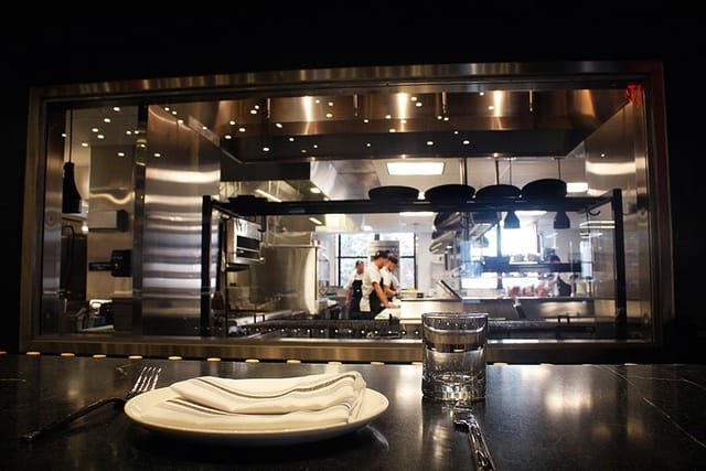 Modern open-concept kitchen in Trillium Fort Point for exclusive dining events.
