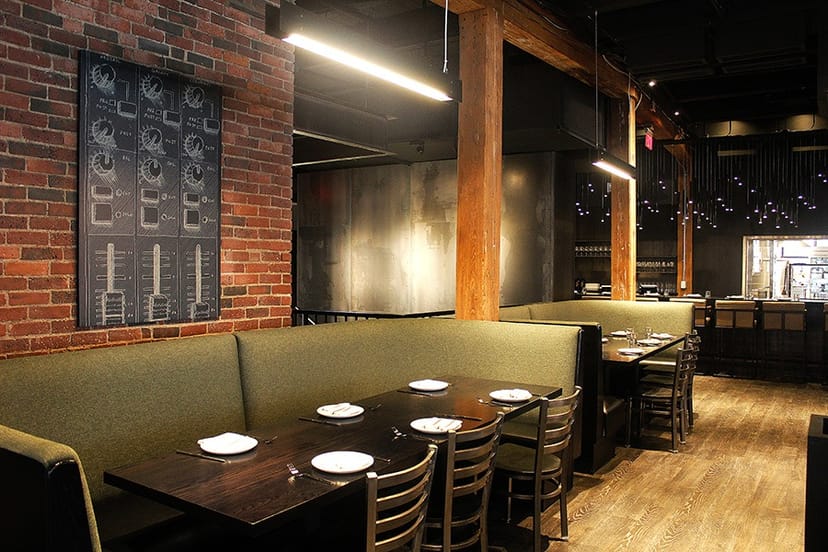 Modern restaurant interior with cozy booths, perfect for dining events and meetings.