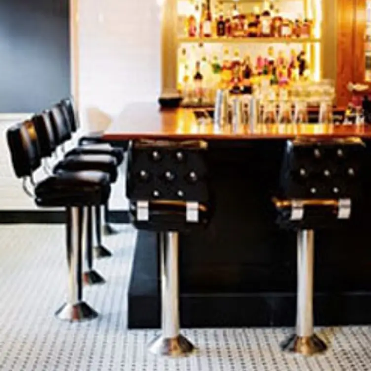 Sleek bar with modern stools at Russell House Tavern for networking events and cocktail receptions.