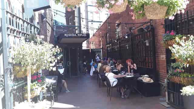 Charming outdoor dining at Russell House Tavern, perfect for casual events and gatherings.