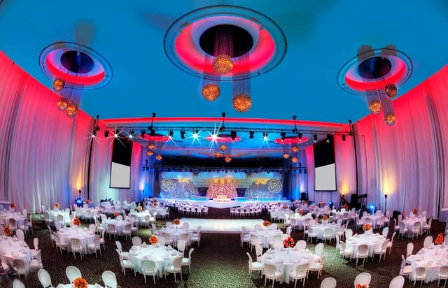 Elegant ballroom with round tables, perfect for conferences and gala dinners in Dubai.