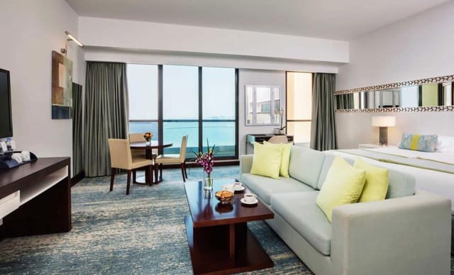 Meeting room at JA Ocean View Hotel with natural light, perfect for executive retreats.