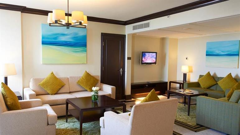 "JA Beach Hotel meeting suite with inviting seating for networking events and discussions."