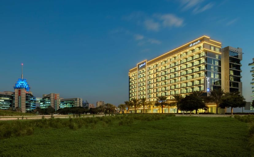 Modern hotel exterior at Radisson Blu Dubai, perfect for meetings and events.