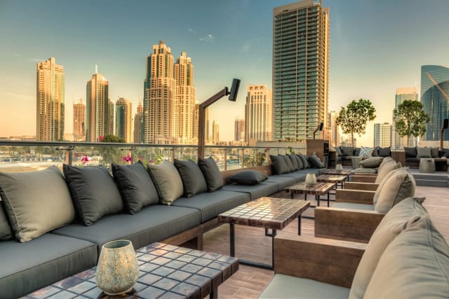 Rooftop lounge in Taj Dubai with plush seating, perfect for upscale events and cocktail parties.