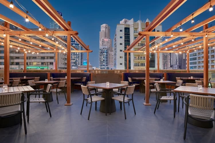 Stylish rooftop restaurant with urban views, perfect for events and receptions.
