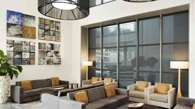 Modern conference room with stylish furniture, ideal for networking events and meetings.