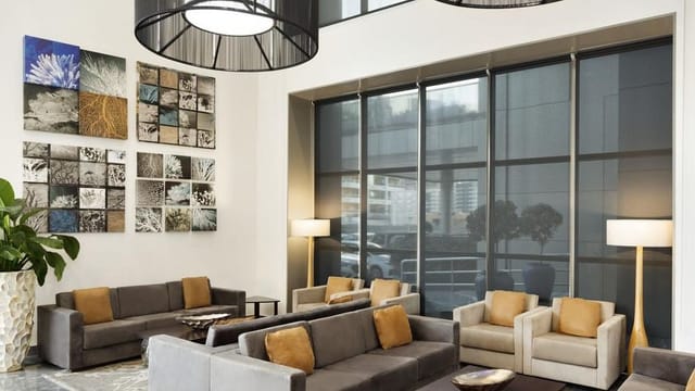 Modern conference room with stylish furniture, ideal for networking events and meetings.