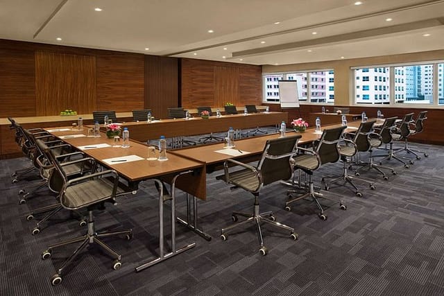 Conference room with ergonomic chairs at Hampton by Hilton Dubai for professional meetings.