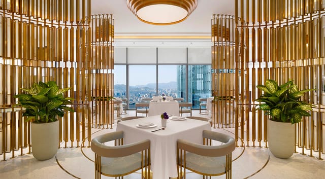 Elegant dining space with gold accents at Eatanic Garden, perfect for corporate events.