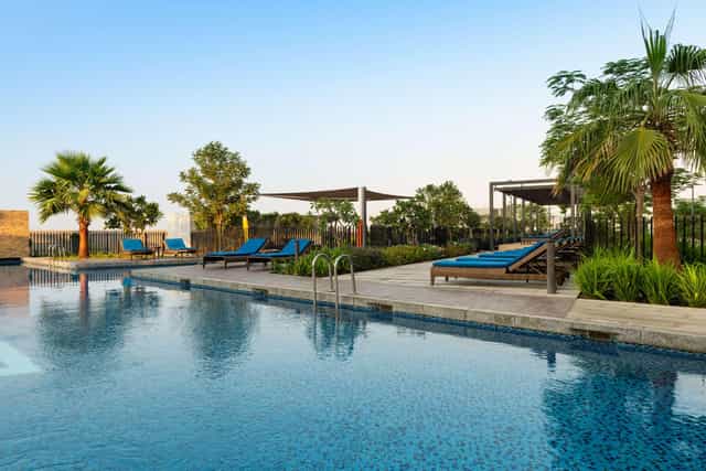 Eagle at Radisson Hotel Dubai poolside, ideal for outdoor events and relaxation.
