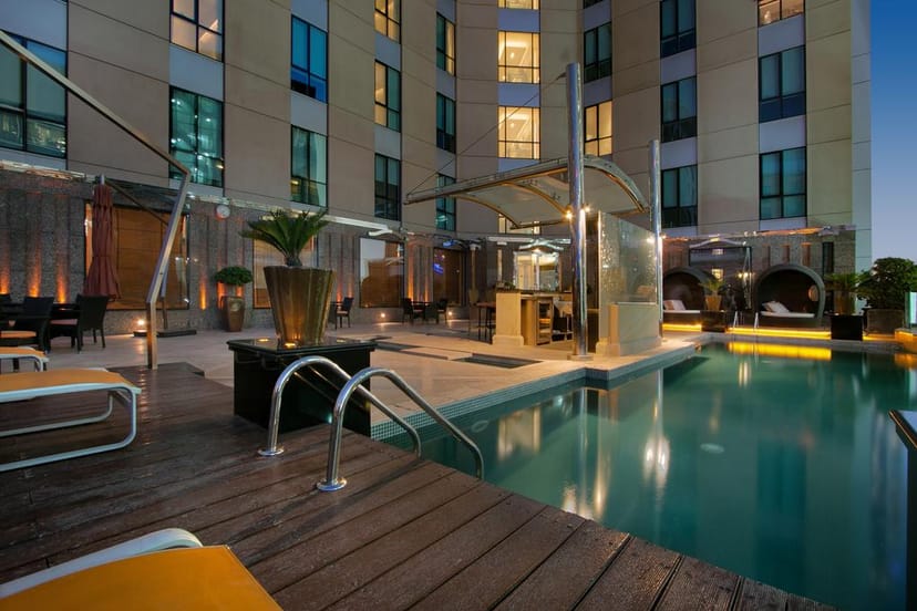 Stylish outdoor pool at Radisson Blu Dubai, perfect for upscale events and networking.