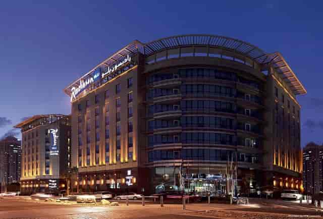 Modern Radisson Blu Hotel exterior in Dubai, ideal for meetings and events.