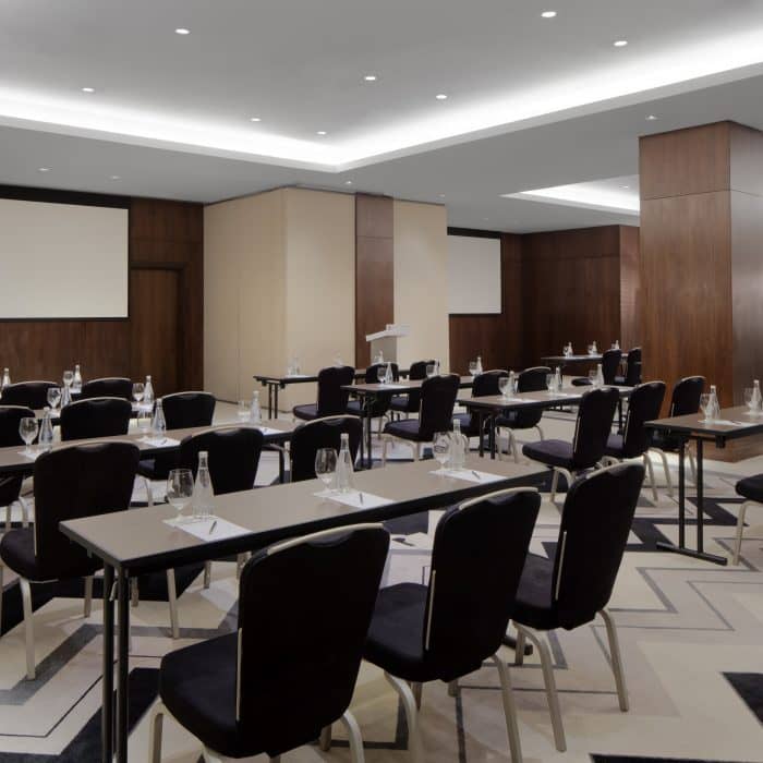 Conference Hall at Pullman Dubai, modern classroom setup for professional events.