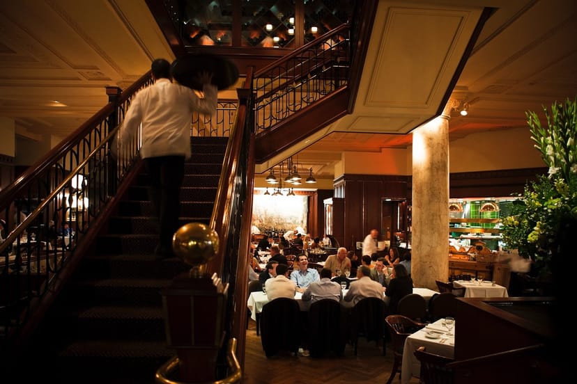 Private dining room at Grill 23 & Bar with elegant staircase, perfect for events and gatherings.