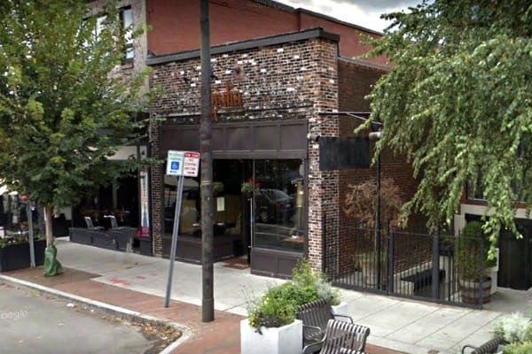 Charming Giulia Restaurant with rustic brick facade, perfect for networking events and gatherings.