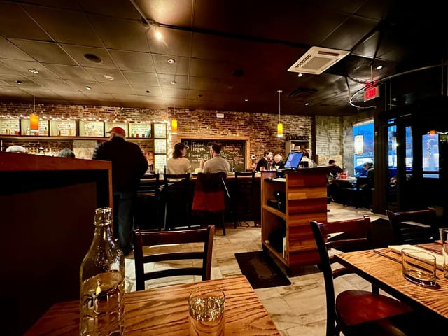 Cozy Giulia Restaurant with warm lighting, ideal for networking events and gatherings.