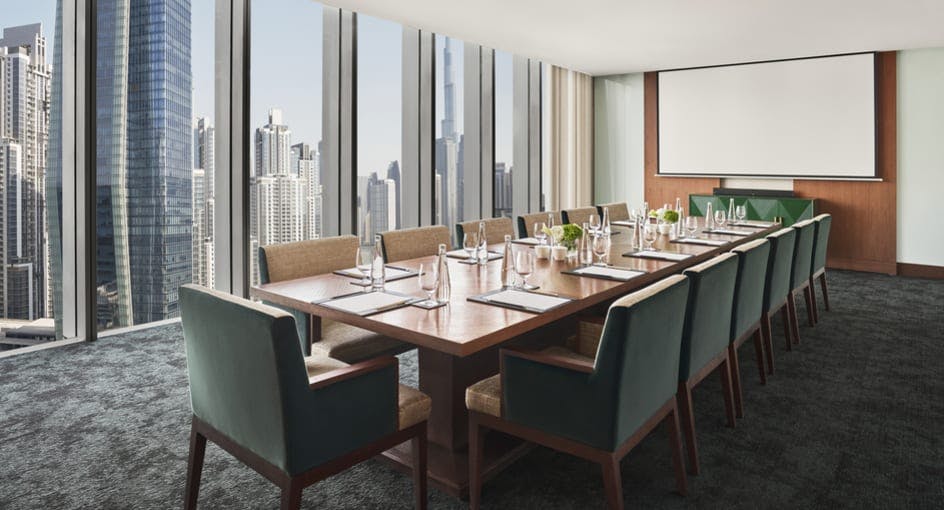 Modern boardroom with city views, perfect for corporate meetings and executive events.