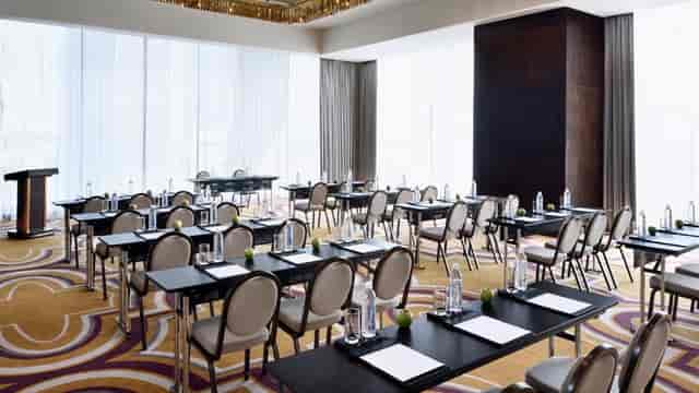 Boardroom at Mövenpick Hotels, featuring natural light for professional meetings.
