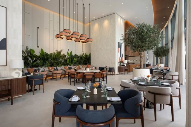 Modern meeting room with stylish seating for events at Vida Hotels and Resorts.
