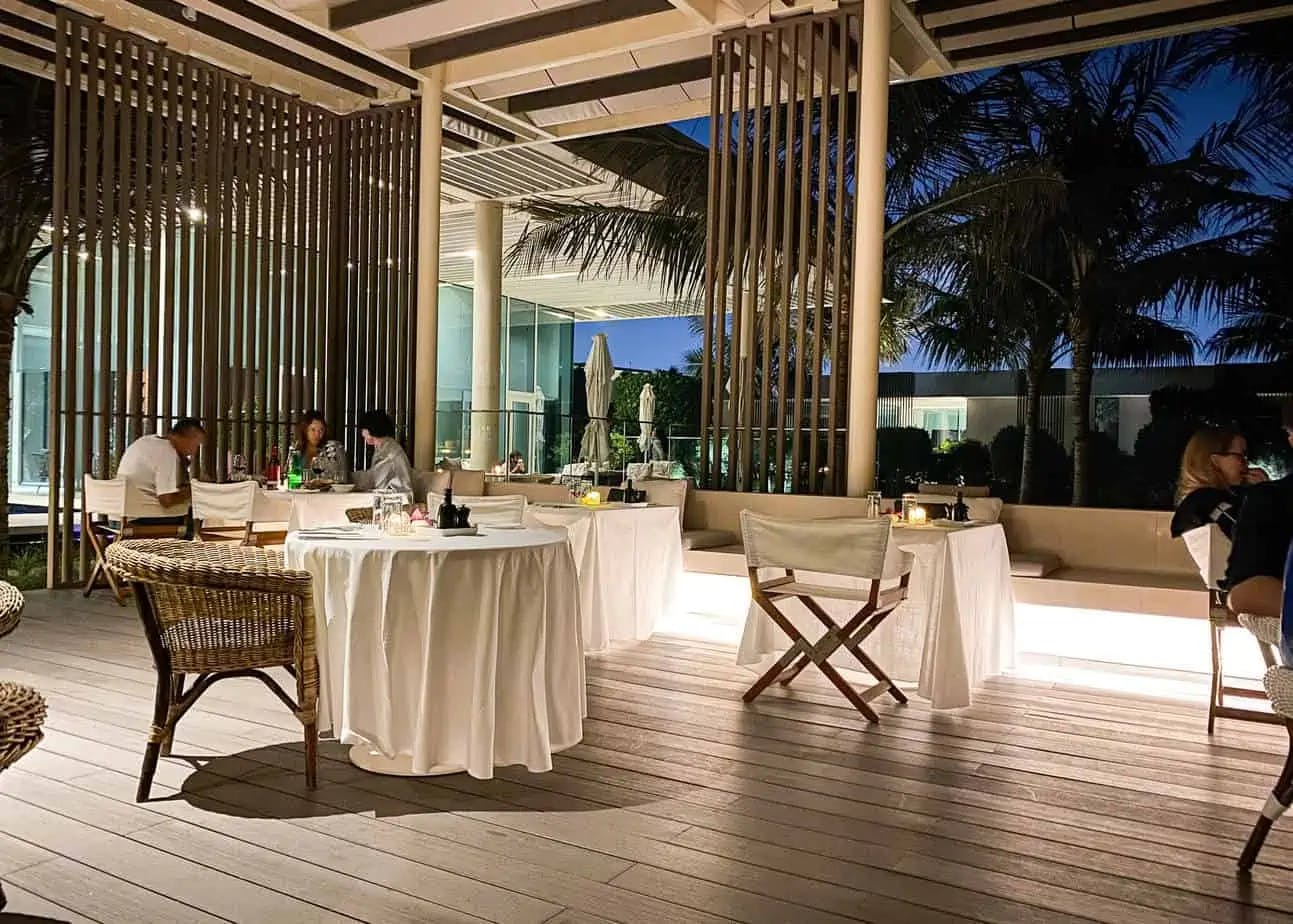 Stylish outdoor dining at Oberoi Al Zorah, perfect for upscale events and gatherings.