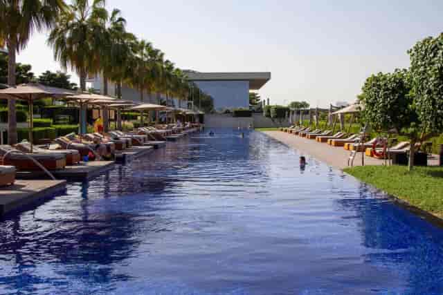 Luxurious beachfront poolside at Oberoi Al Zorah, ideal for upscale events and gatherings.