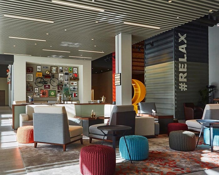 Modern lounge at Rove Downtown Hotel, perfect for networking and relaxation events.