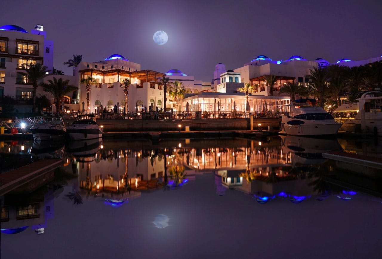 Fountain Garden at Dubai Creek Resort, illuminated waterfront venue for upscale events.