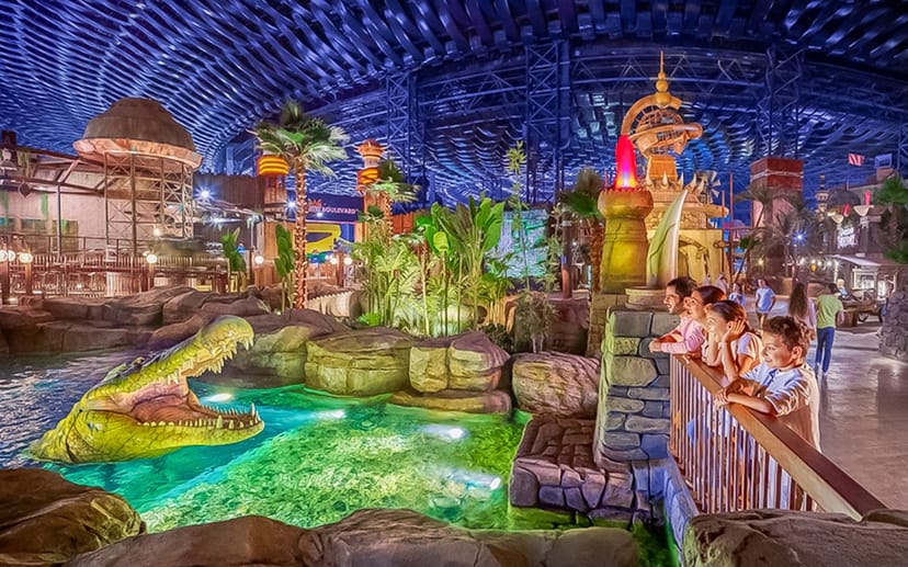 Private party area with crocodile exhibit at IMG Worlds of Adventure for events.