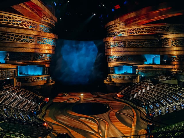 La Perle auditorium stage with dynamic lighting for impactful performances and events.