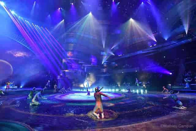 Vibrant stage performance at La Perle theater with dynamic lighting for gala events.