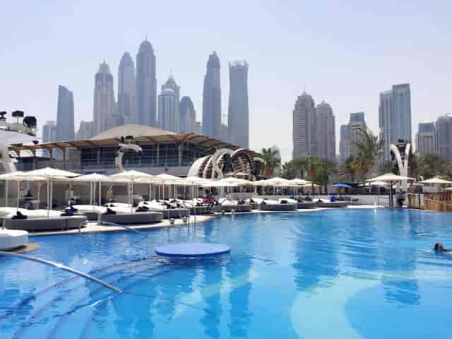 Beach in Zero Gravity poolside venue with cabanas, ideal for upscale events and gatherings.