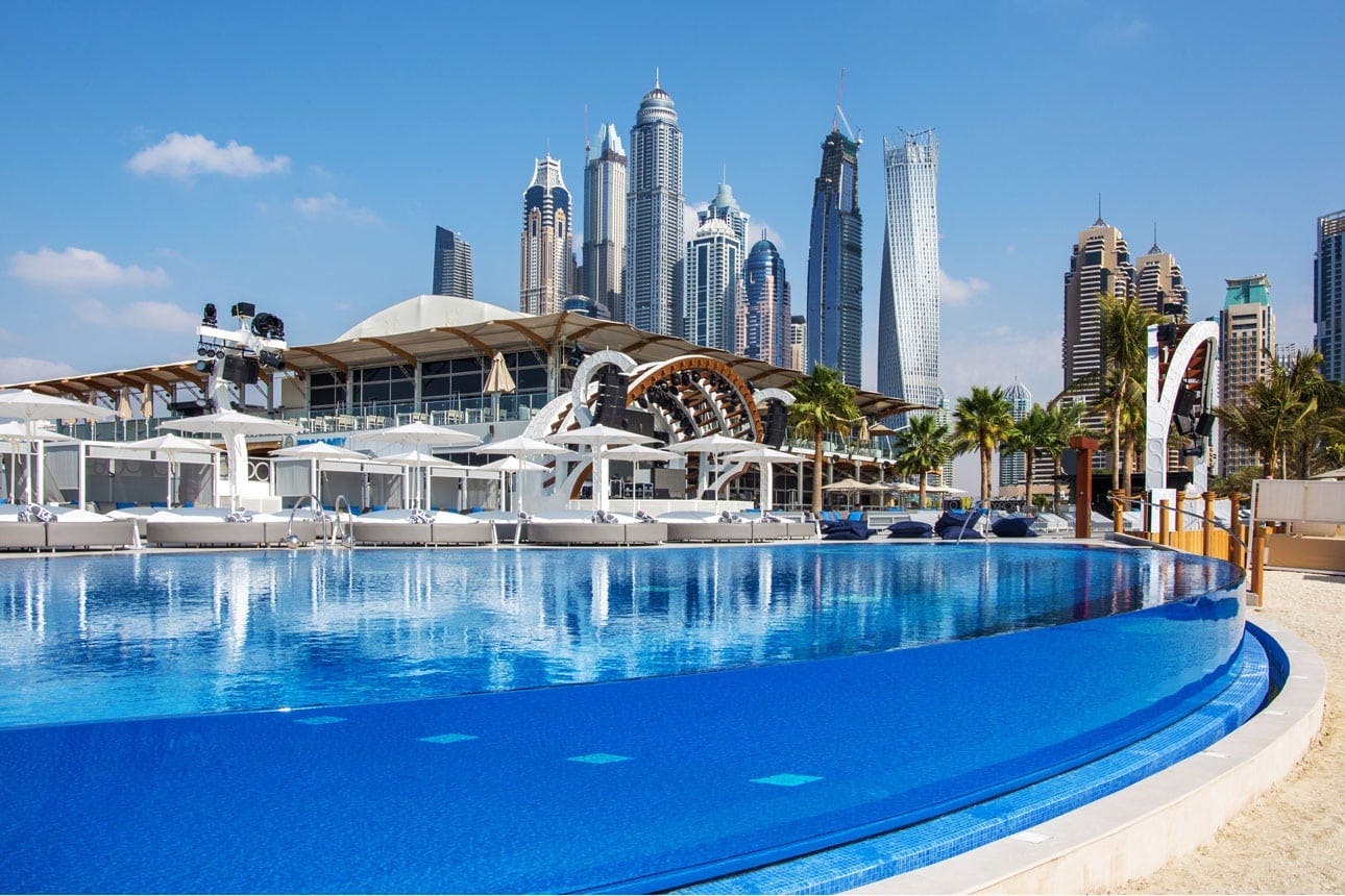 Infinity pool with Dubai skyline, perfect for corporate events and exclusive gatherings.
