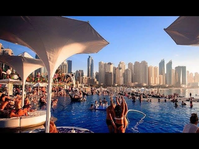 Vibrant poolside venue with skyline, perfect for upscale events and social gatherings.