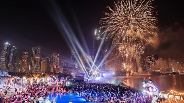 Vibrant garden event with fireworks and city skyline, perfect for corporate celebrations.