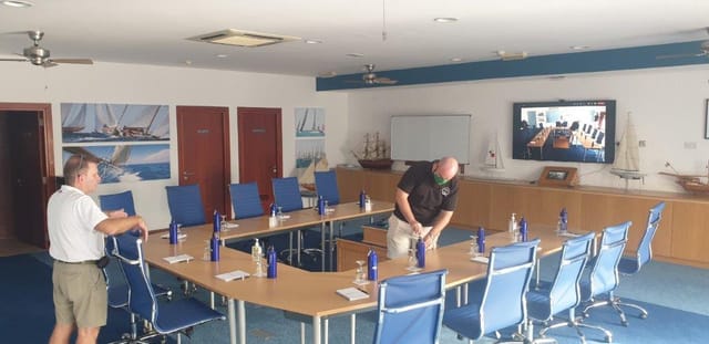 Meeting room at Dubai Offshore Sailing Club with circular table and nautical decor.