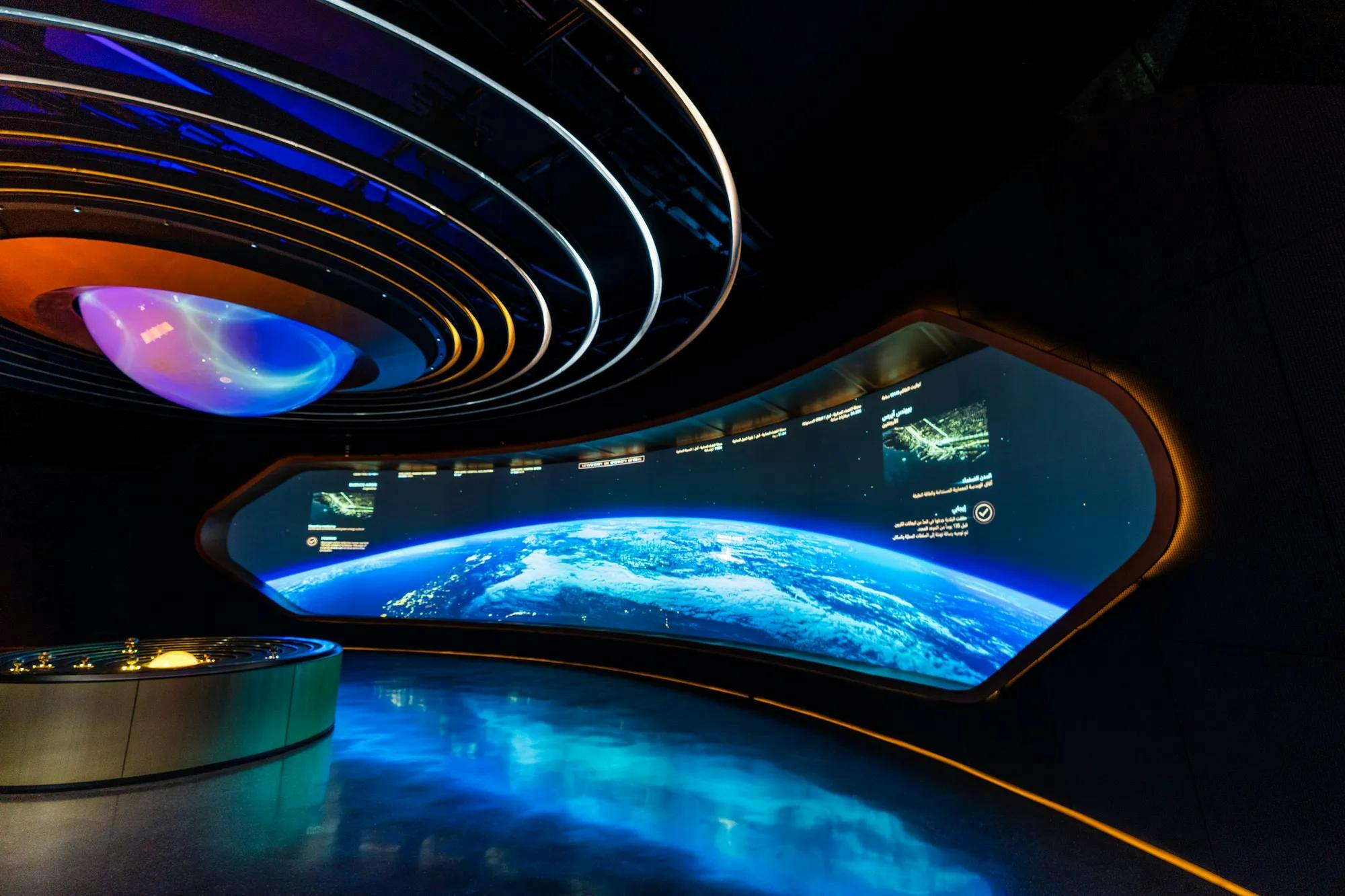 Exhibition Hall at Museum of the Future with curved screen for tech events and launches.